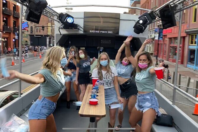 Open Air Party Bus with DJ & Bartender 21+ - DJ, Bartender, TVs, and Refrigeration: The Onboard Perks That Count